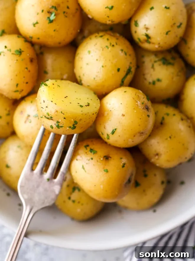 taking a bite of a boiled potato