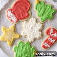 Closeup of frosted sugar cookies on a plate, showcasing their inviting texture