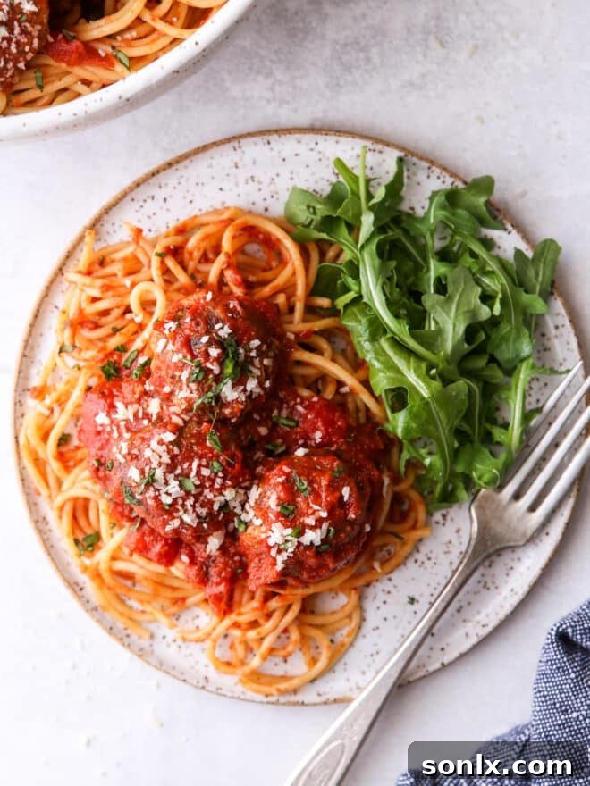Homestyle Spaghetti and Meatballs 8 spaghetti and meatballs on a plate with salad