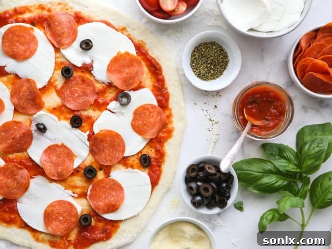 A delicious pepperoni pizza being assembled, with toppings carefully added to the prepared pizza dough.