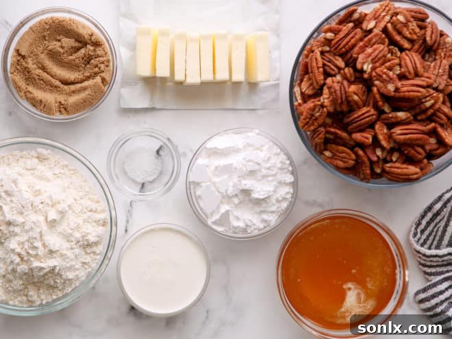 Arrangement of fresh baking ingredients for pecan pie bars including flour, butter, pecans, honey, and brown sugar