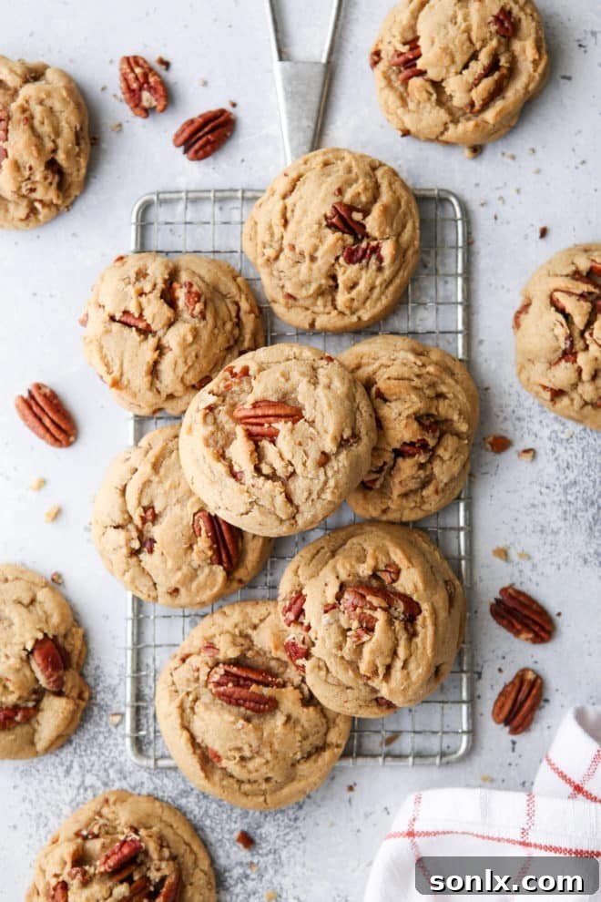 A stack of perfectly baked brown butter pecan cookies, revealing their inviting texture and rich color, ready to be enjoyed.