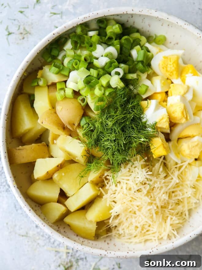 adding potato salad ingredients to a bowl