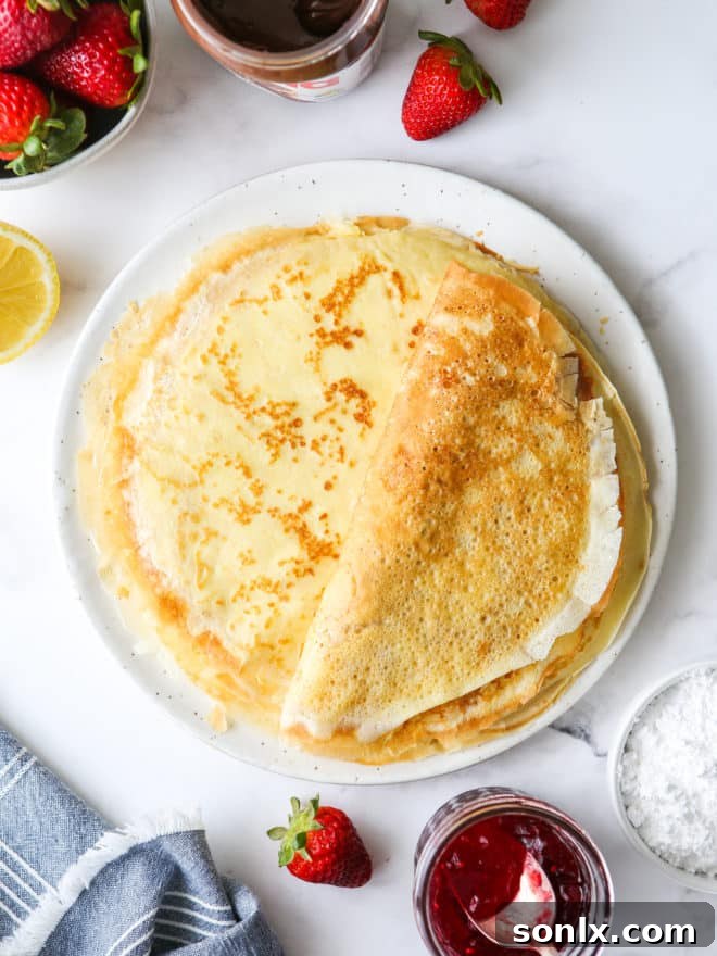a stack of homemade crepes on a plate