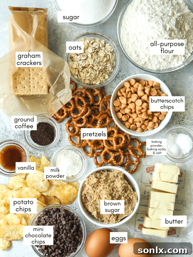 All ingredients for kitchen sink cookies laid out on a baking surface