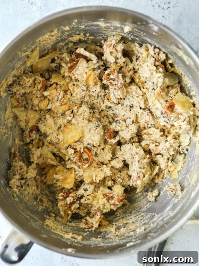 Close-up of mixed kitchen sink cookie dough with visible mix-ins