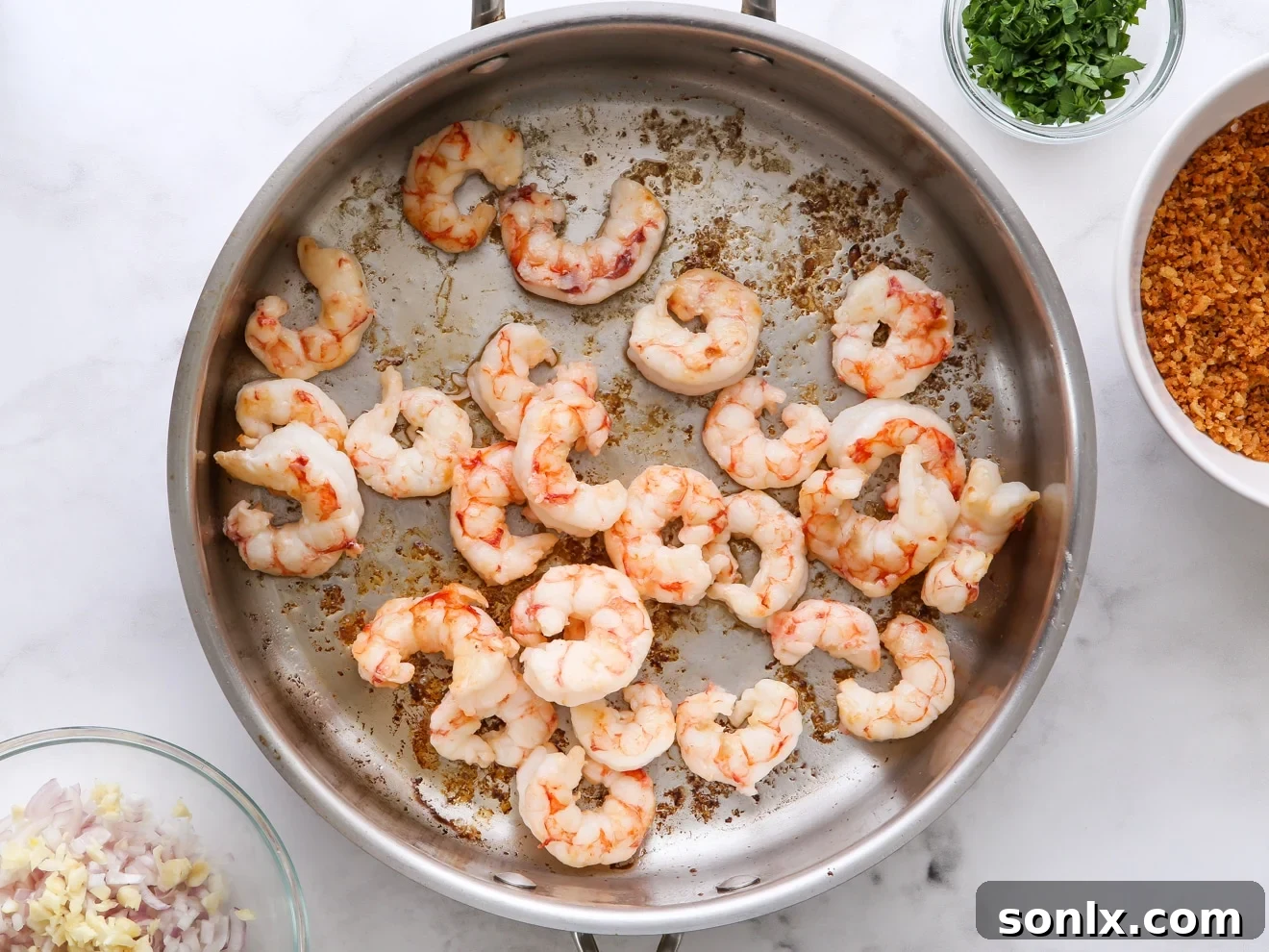 step 2: cook shrimp in a skillet until lightly browned