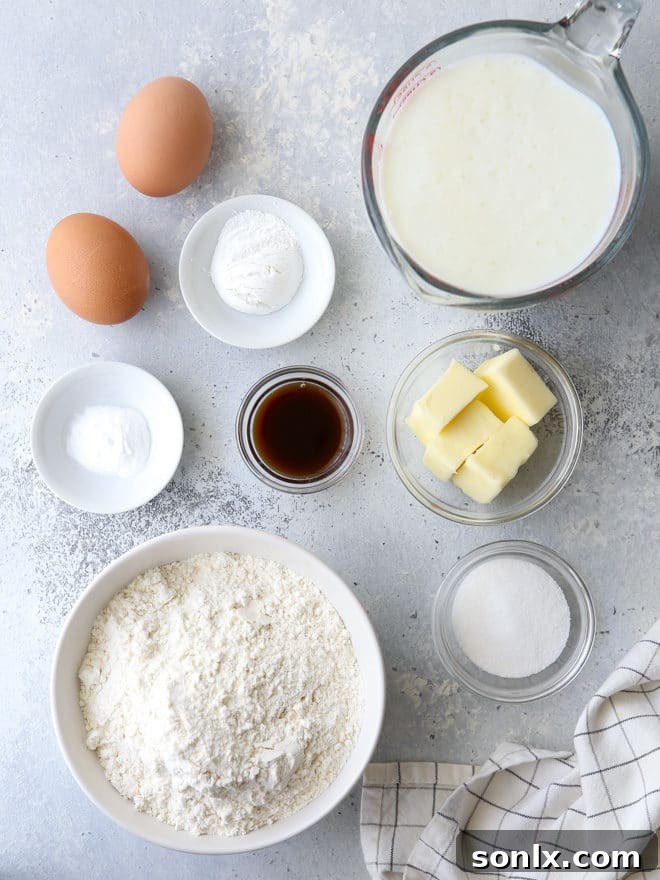 Close-up of a stack of golden buttermilk pancakes, highlighting their fluffy texture and delicious appearance, ready to be topped.