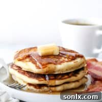 A delicious stack of fluffy buttermilk pancakes ready for breakfast.