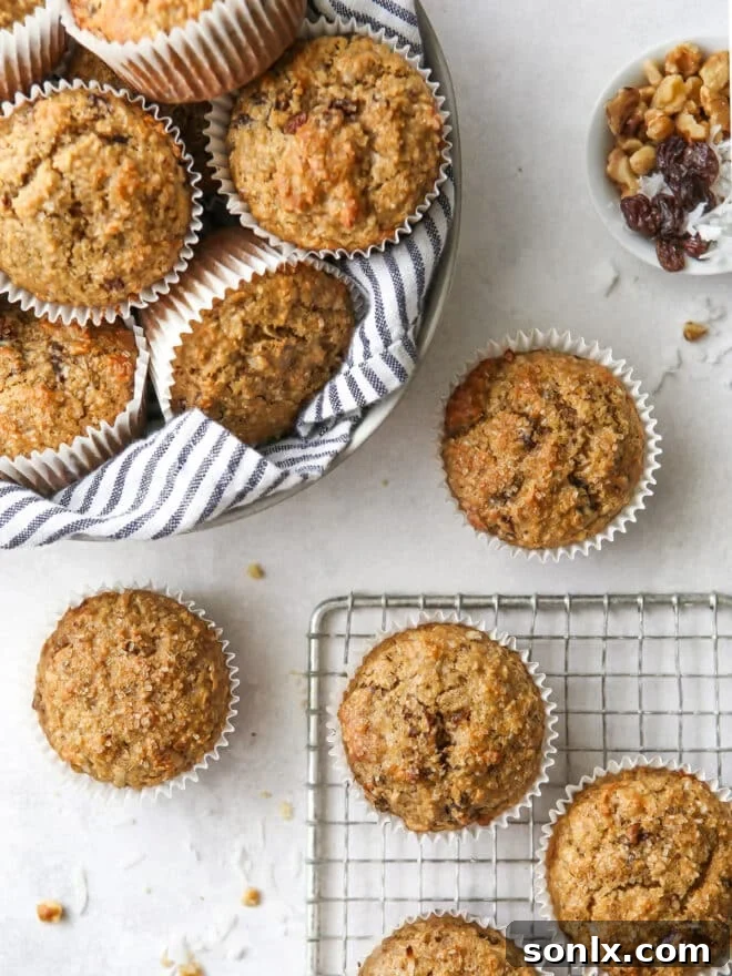 Freshly baked bran muffins with banana, walnuts, coconut, cinnamon, and raisins.