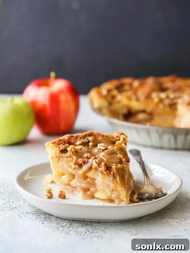 slice of apple pear praline pie on a plate