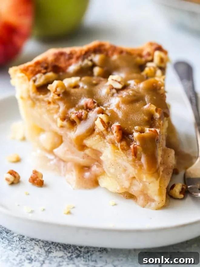 closeup of apple pear praline pie slice on plate