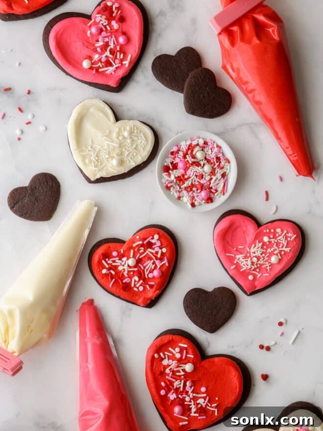 Delicately frosted sugar cookies adorned with sprinkles, ready for Valentine's Day baking