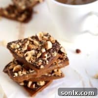 Coffee Toffee, a rich, buttery candy infused with coffee and topped with chocolate and hazelnuts.
