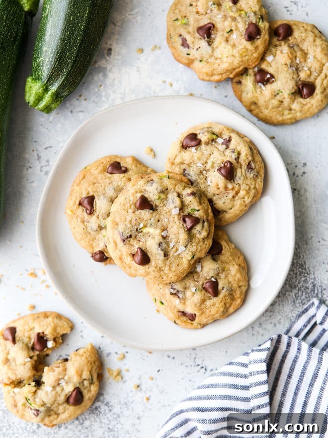 Delicious zucchini chocolate chip cookies on a white plate, showcasing the perfect way to enjoy fresh zucchini in baking.
