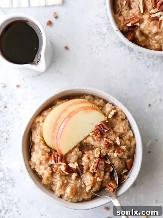 Warm apple cinnamon oatmeal bowls, garnished with crunchy pecans and a drizzle of maple syrup.