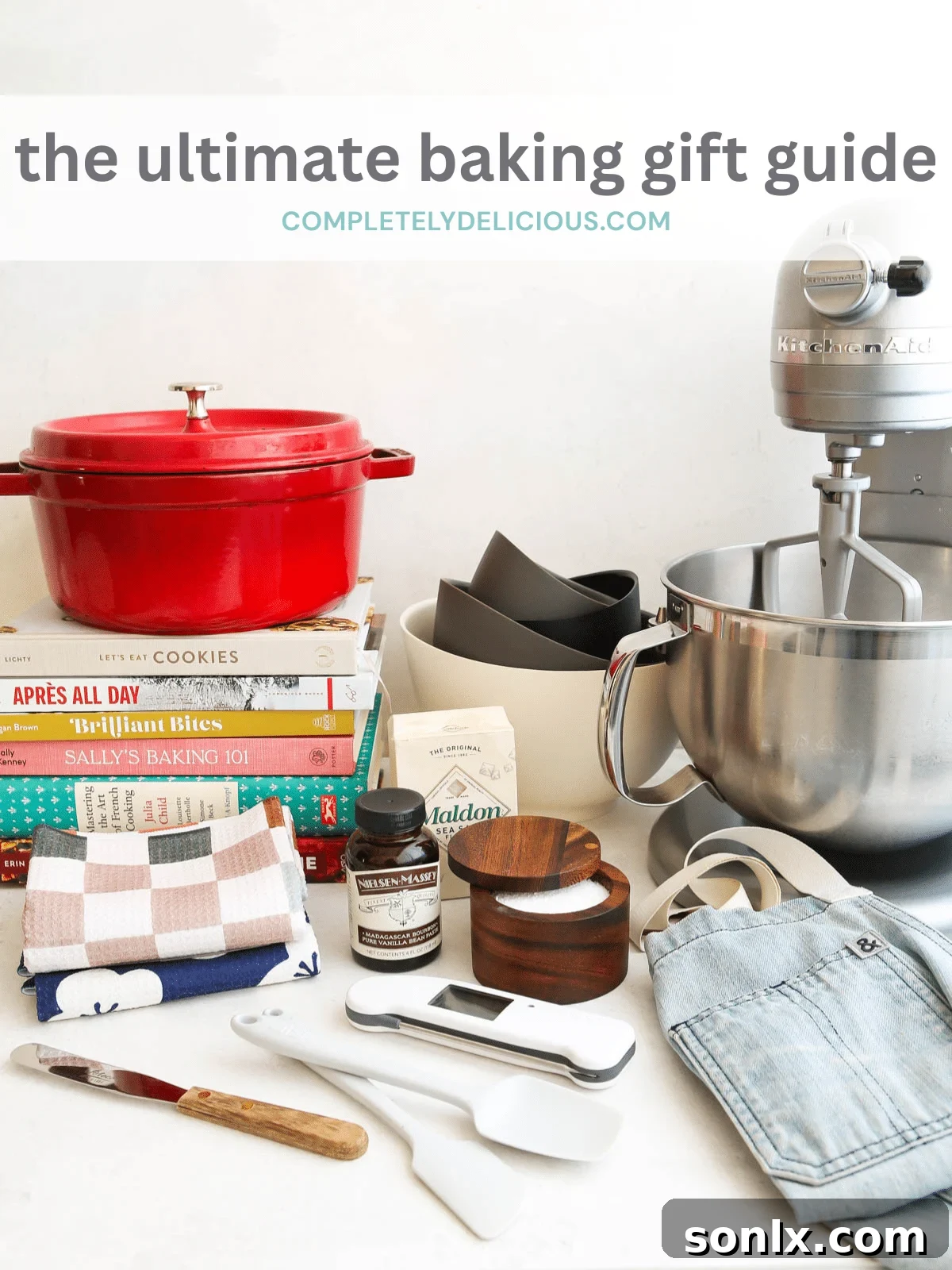 The best baking gift guide for any baker, featuring a beautifully decorated cake and an array of baking essentials.