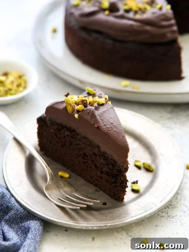 A delectable slice of chocolate olive oil cake served on a white plate