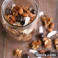 Winter Trail Mix - with granola clusters, toasted coconut and almonds, and chocolate covered berries | completelydelicious.com