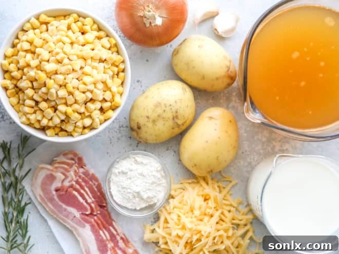 A vibrant selection of fresh ingredients laid out for making corn chowder, including corn on the cob, potatoes, onions, and various cheeses.