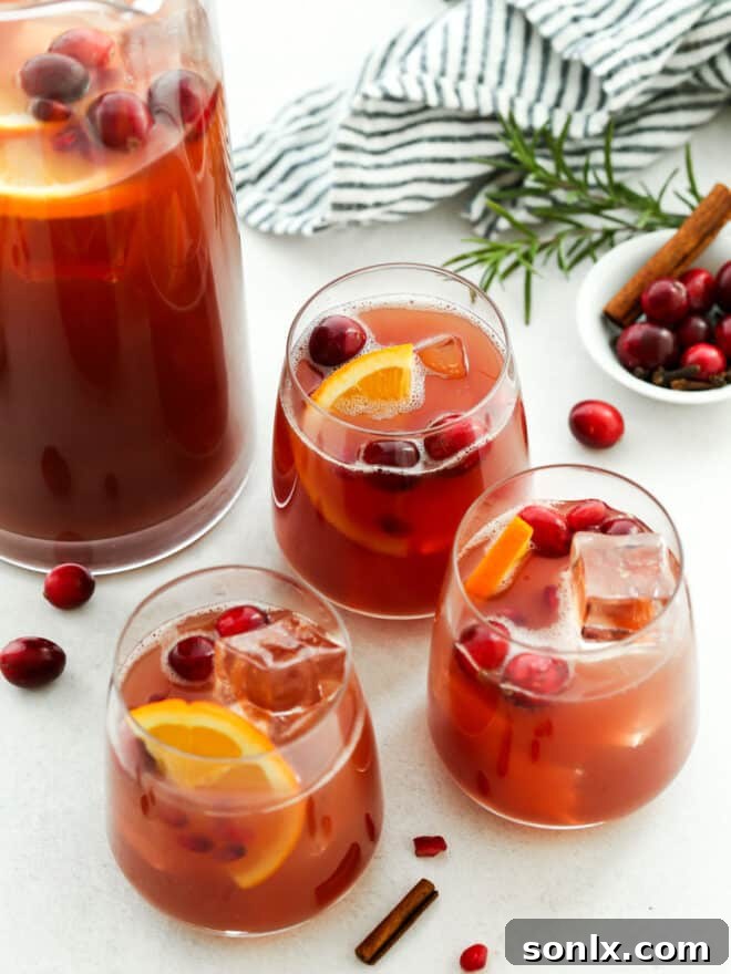 holiday punch in individual glasses with pitcher in background