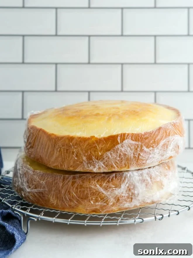 Cake layers thawing at room temperature while still wrapped in plastic.