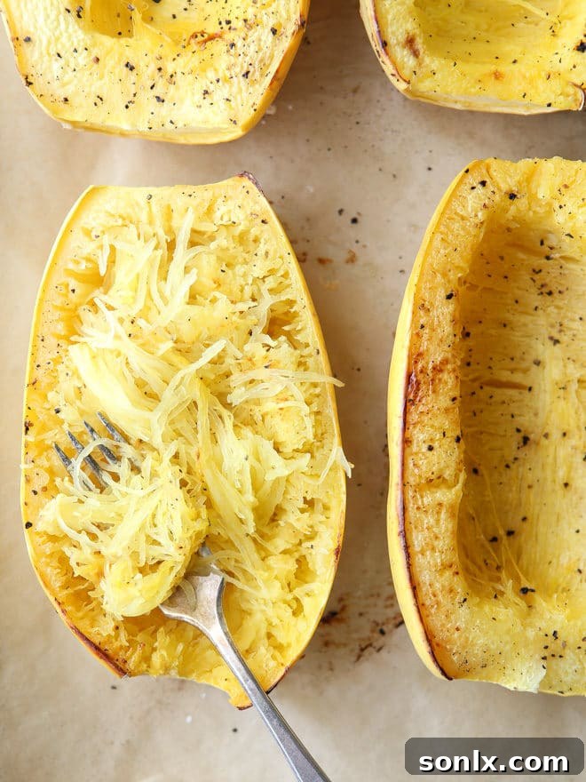 Halved spaghetti squash with seeds removed, ready for cooking