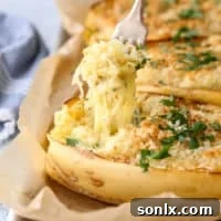 A close-up of the baked spaghetti squash with cheese, ready to eat.