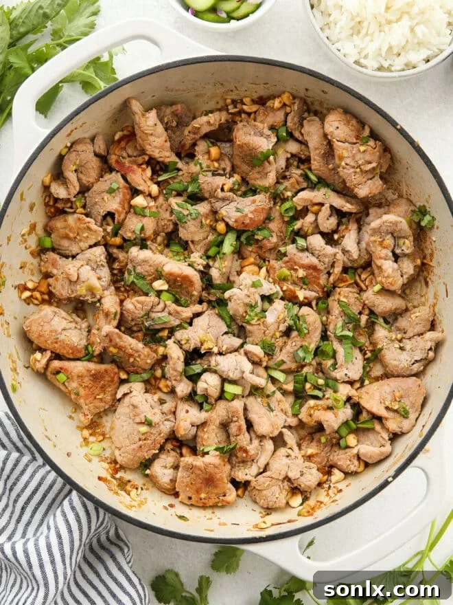 stir-fried thai lemongrass pork in a skillet
