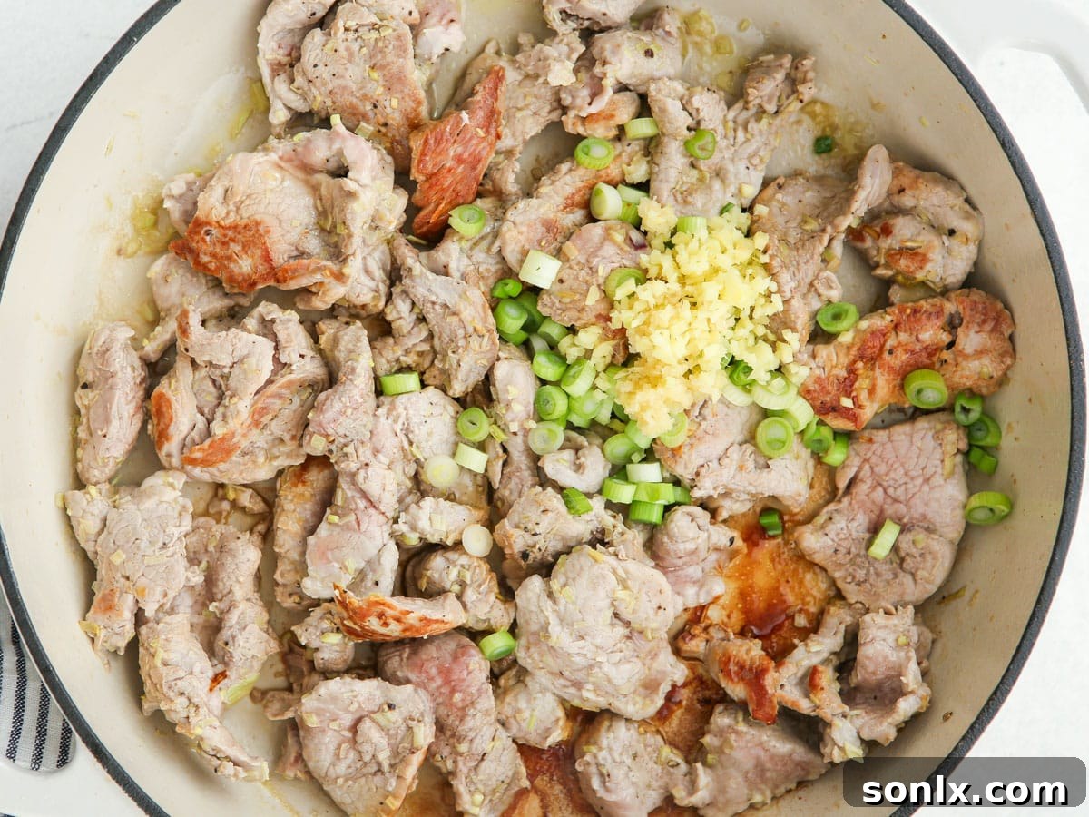 stir-fried thai lemongrass pork in skillet