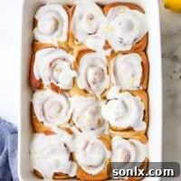 Glazed lemon cinnamon rolls in a pan, featured as the recipe image