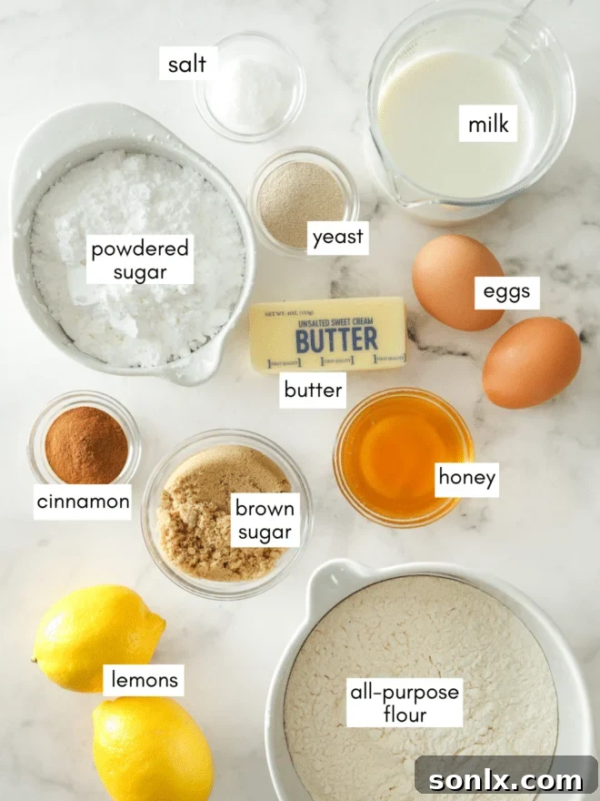 Arrangement of fresh ingredients for lemon cinnamon rolls including lemons, flour, sugar, butter, and cinnamon sticks