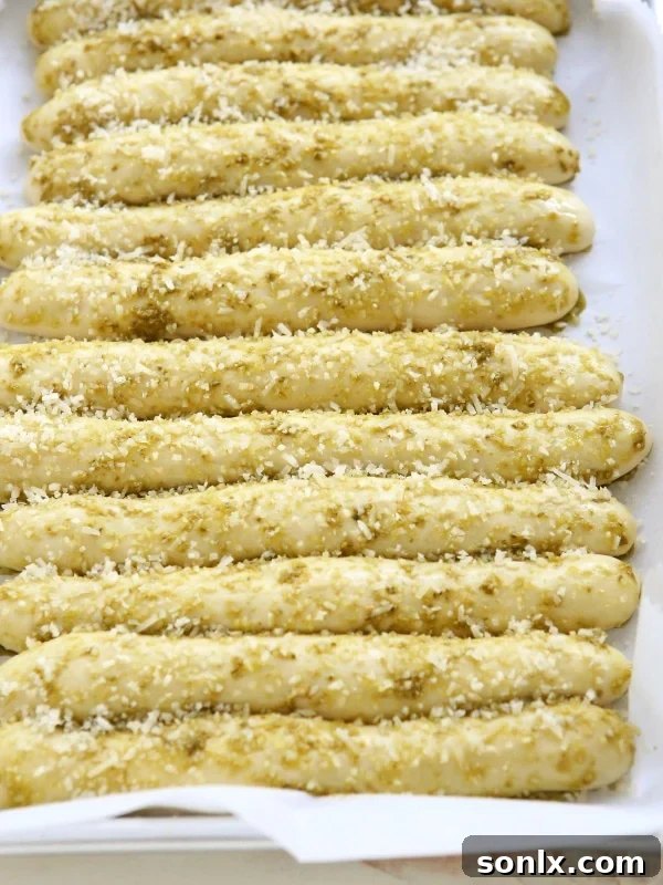 A tray of Pesto Parmesan Pull Apart Breadsticks ready for baking