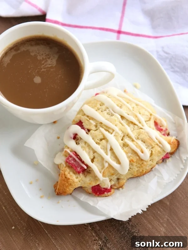 Rhubarb Vanilla Bean Scones with a delicate white glaze, ready to be served and enjoyed.