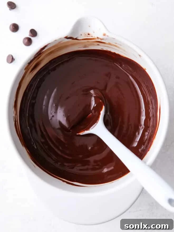 smooth chocolate ganache in a glass bowl