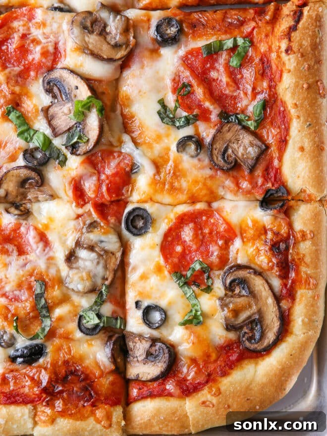 Close-up of a perfectly baked homemade pizza, with golden crust and bubbling, melted cheese.