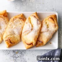 Cream cheese Danishes on a plate with a cup of coffee
