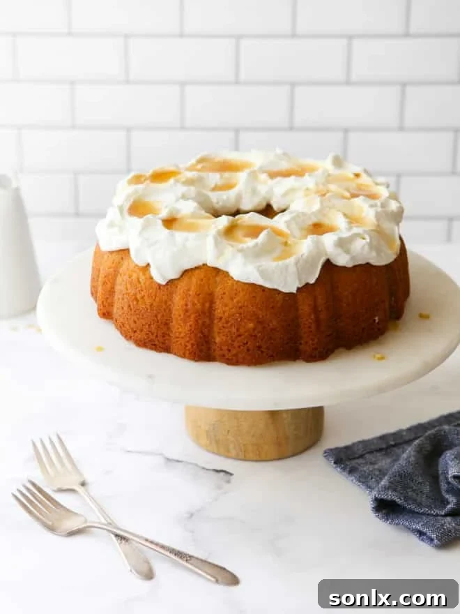 maple bundt cake on a cake stand with forks on the table