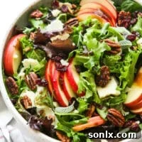 closeup of fall apple salad with serving spoon