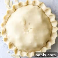 Buttermilk pie crust, golden and ready for oven, promising deliciousness.