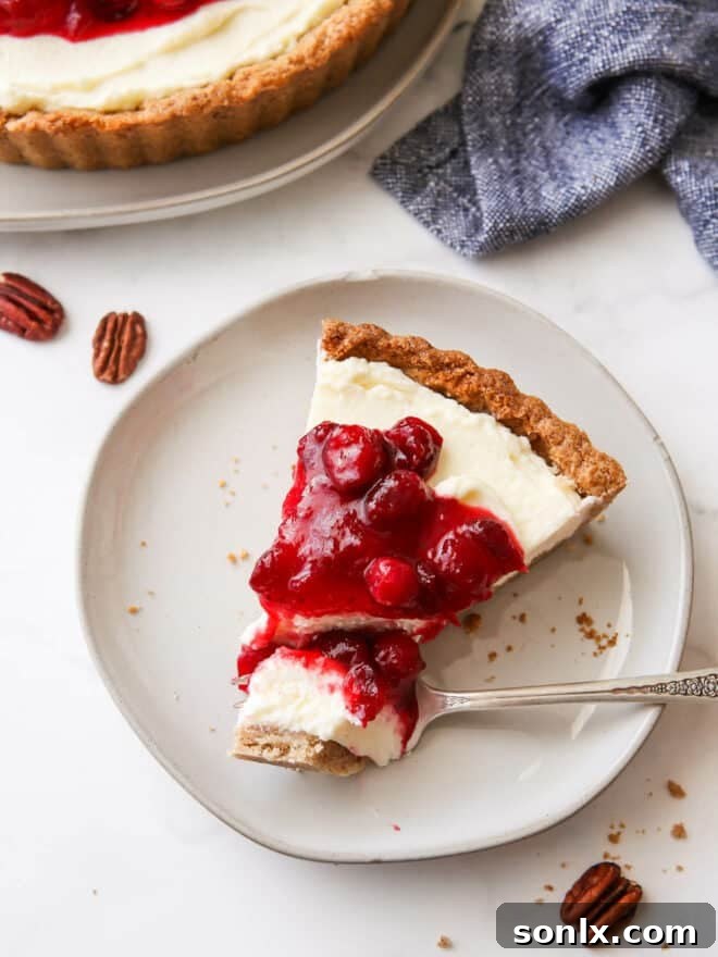 slice of cranberry mascarpone tart with bite on fork