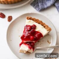 slice of cranberry mascarpone tart with bite on fork