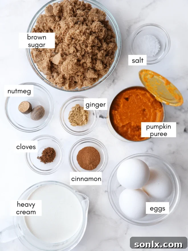 Individual ingredients for pumpkin pie laid out on a table: pumpkin puree, eggs, spices, and a container of heavy cream.