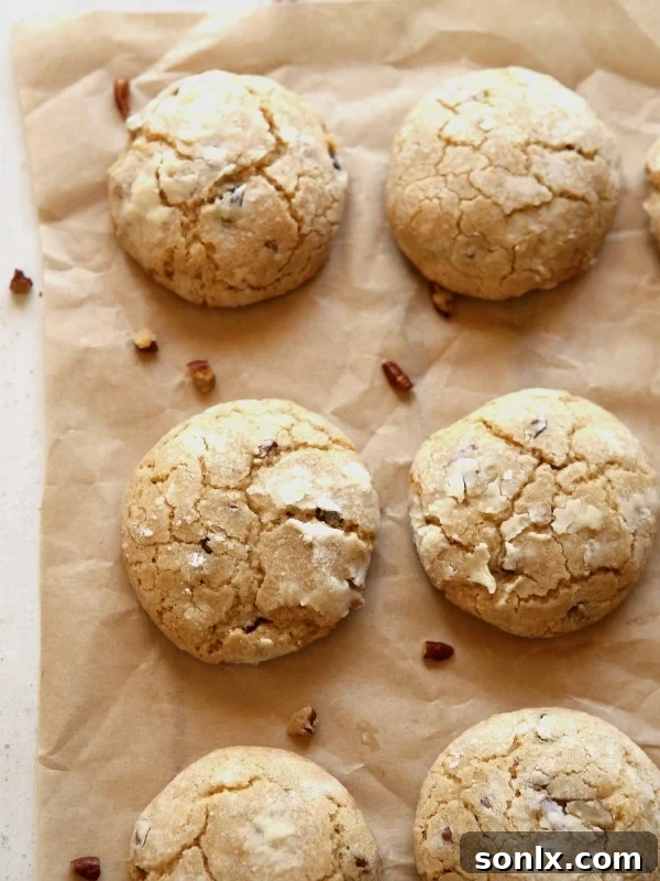 Delicious Brown Butter Cinnamon Crinkle Cookies with Pecans on a cooling rack.
