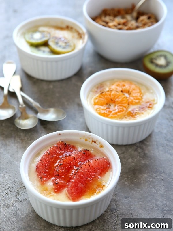 Close-up of Yogurt Brûlée with a golden caramelized sugar crust, surrounded by fresh slices of winter citrus and kiwi, highlighting the texture.