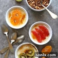 Yogurt Brûlée with Winter Fruit in a ramekin with a crispy caramel top and fresh fruit slices, ready to serve.
