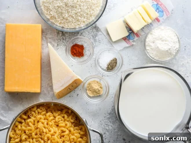 Ingredients for baked macaroni and cheese laid out on a kitchen counter.
