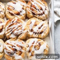 Baked cinnamon roll biscuits in a pan