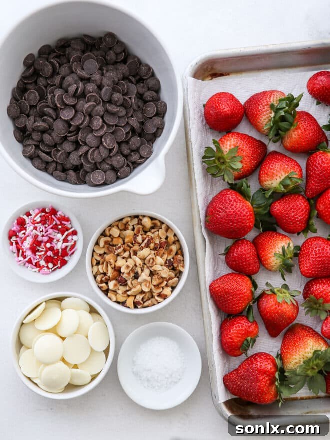Close-up of fresh strawberries and chocolate ingredients laid out for preparation.