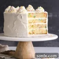 This funfetti cake made with light and buttery vanilla cake layers studded with rainbow sprinkles and fluffy vanilla buttercream frosting is such a fun and cheerful dessert!